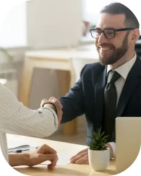 Accountant shaking hands with client in office meeting